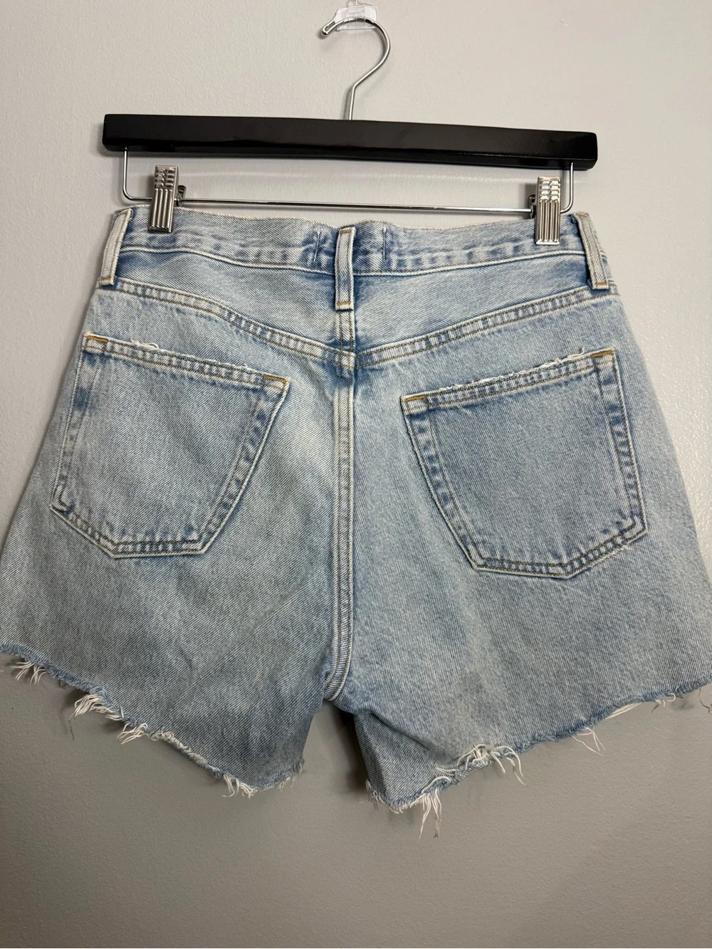 13. AGOLDE Light Wash Distressed High-Rise Denim Shorts - Parker Long